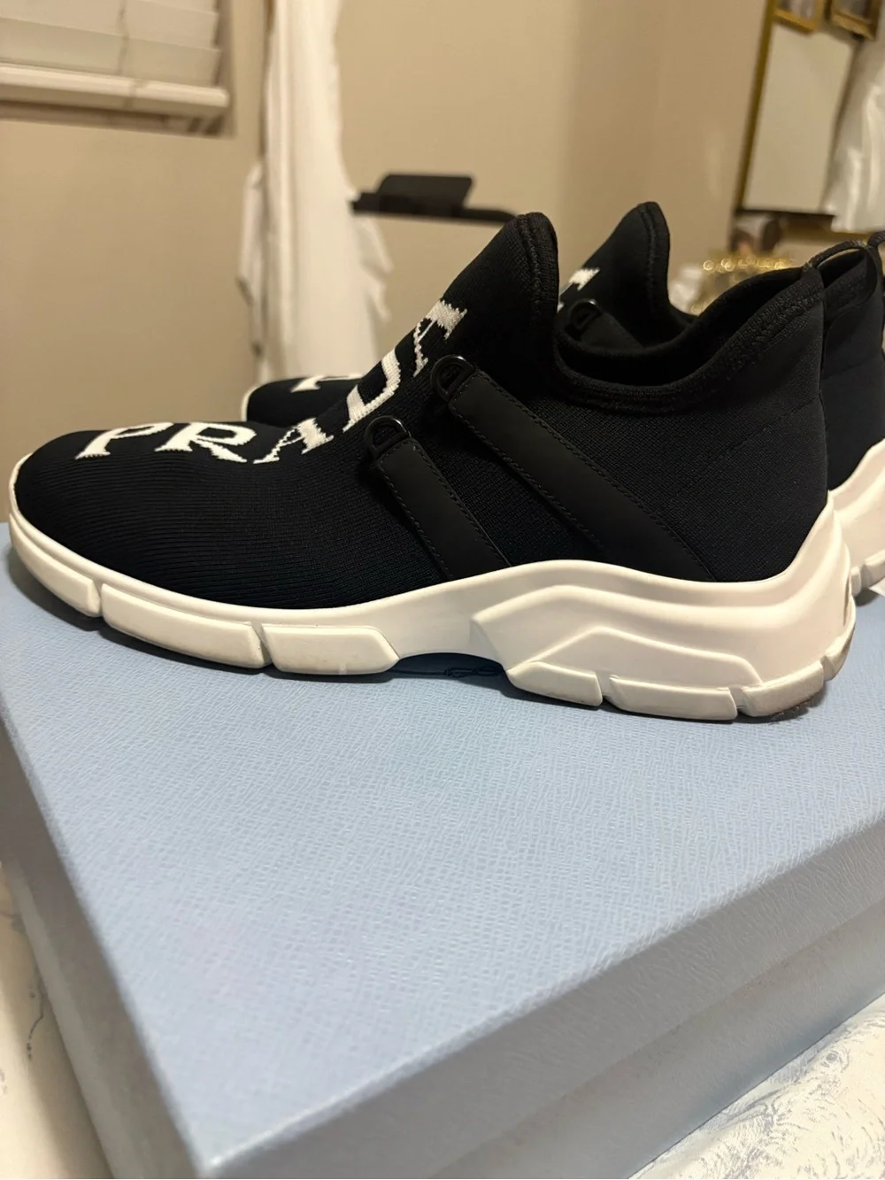 Prada womens Black Logo Knit Slip-On Sneakers